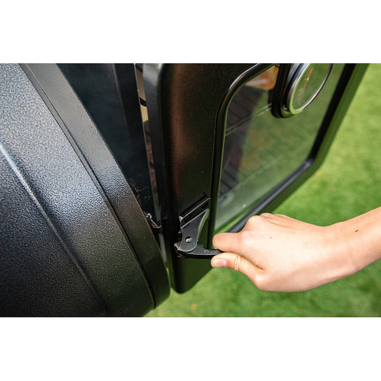 Pit Boss Side Smoker Attachment man closing smoker door