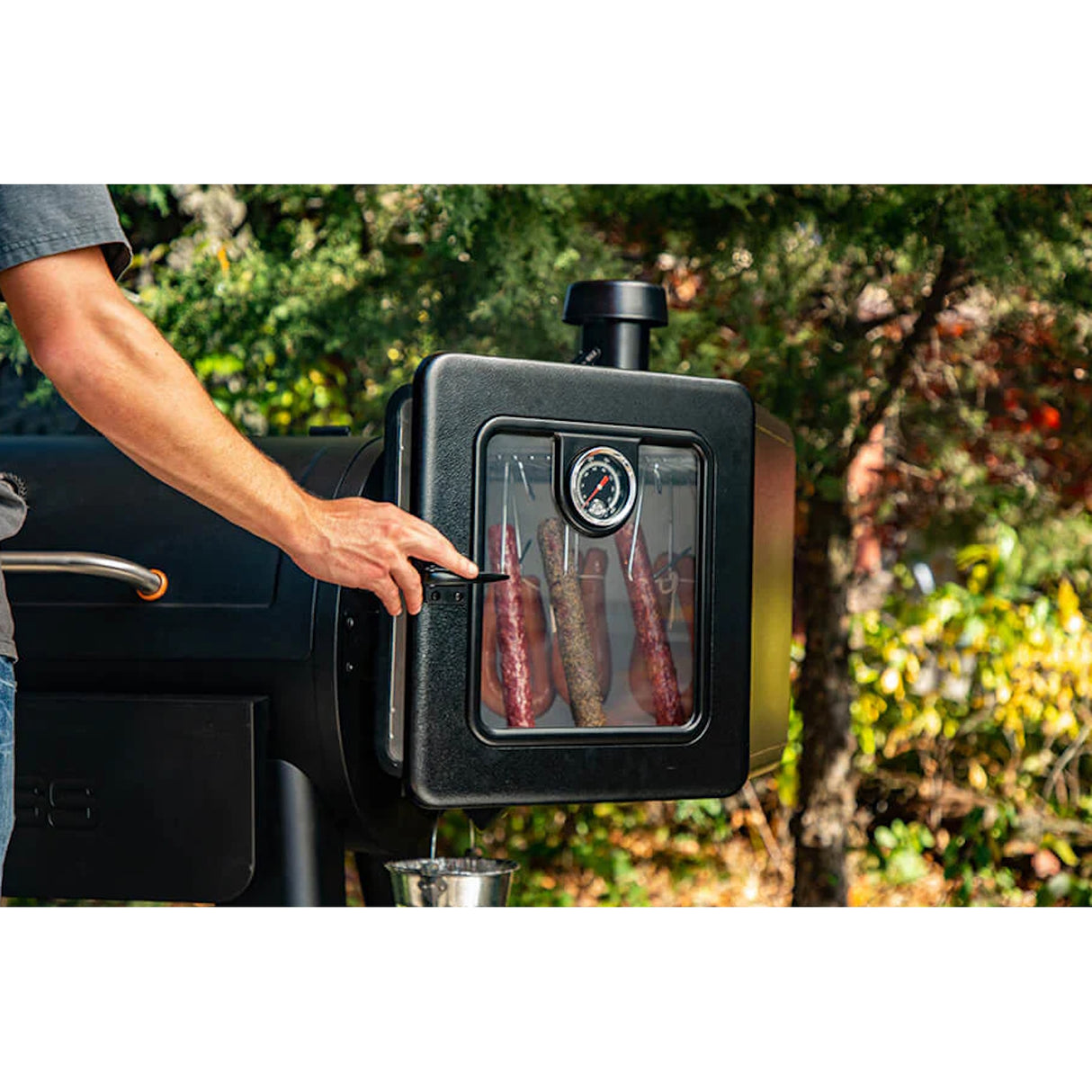 Pit Boss Side Smoker Attachment backyard man smoking meat