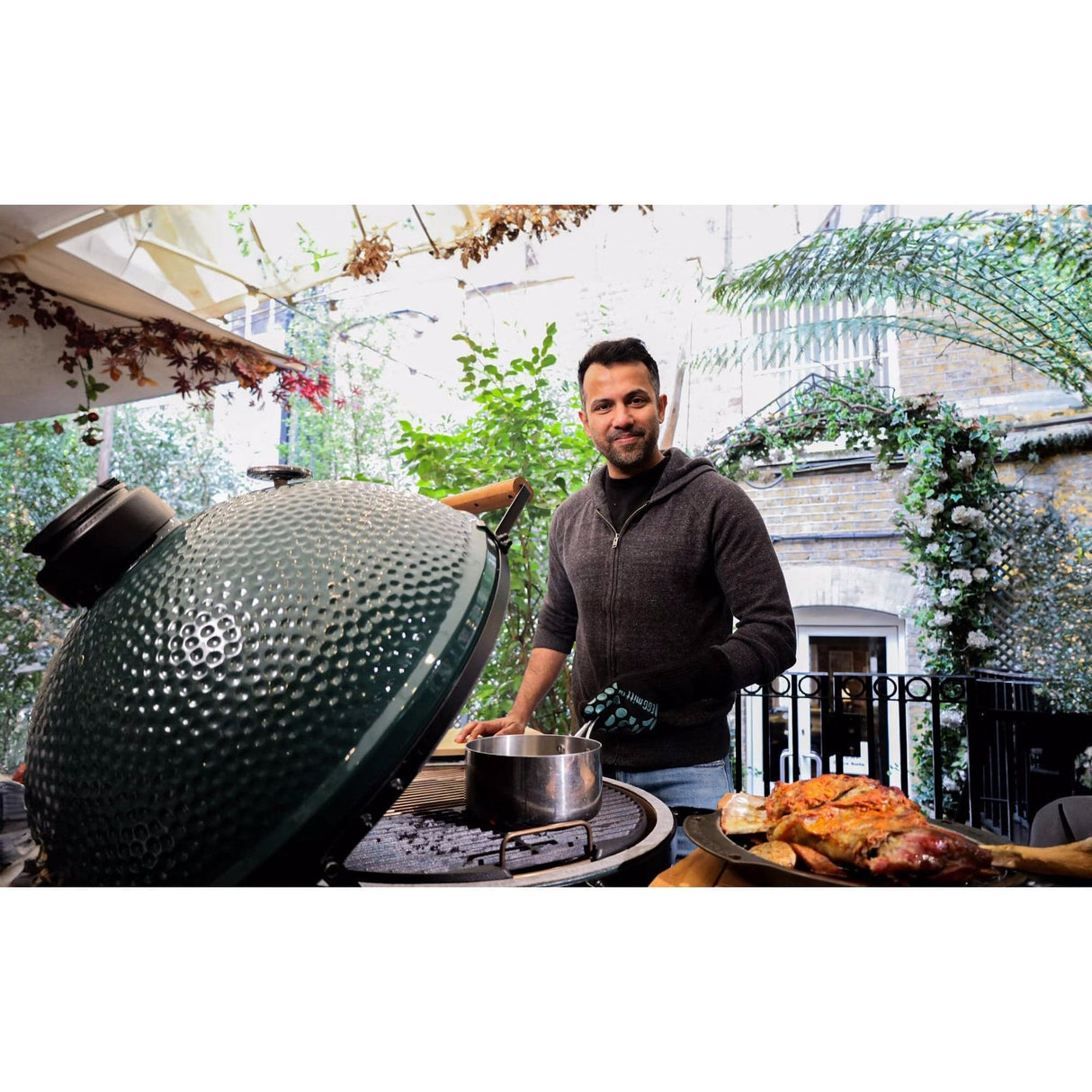 XL EGG IntEGGrated Nest Bundle man cooking in backyard