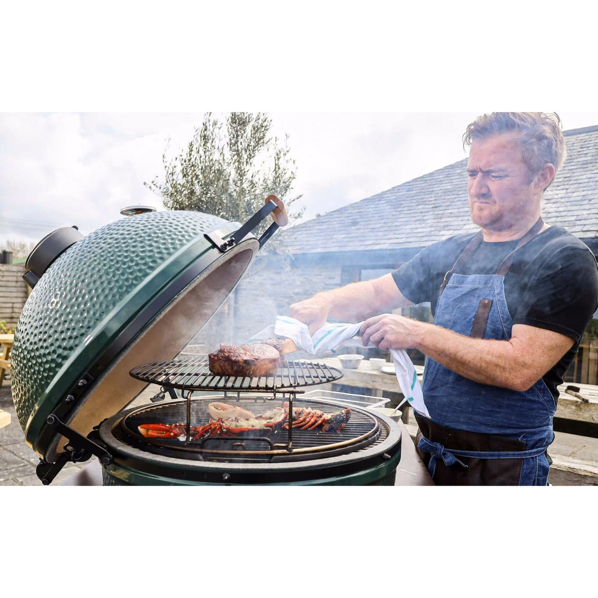 XL EGG Mahogany Table Bundle grilling steak in backyard