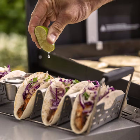 Weber Stainless Steel Taco Rack squeezing lime on tacos