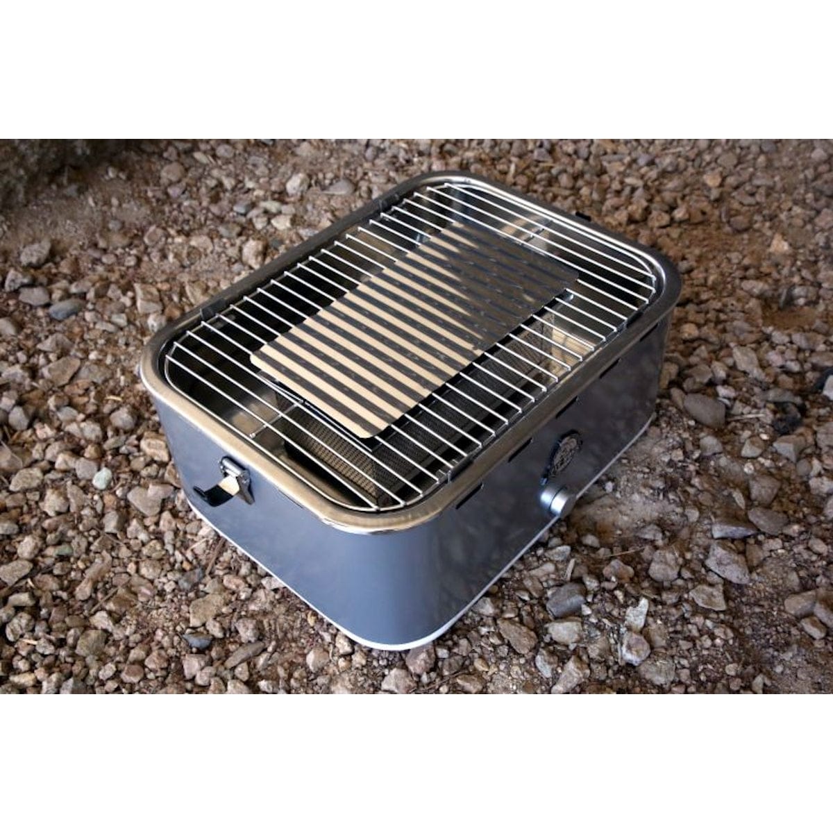 Pit Boss Grills Portable Charcoal Grill open on ground