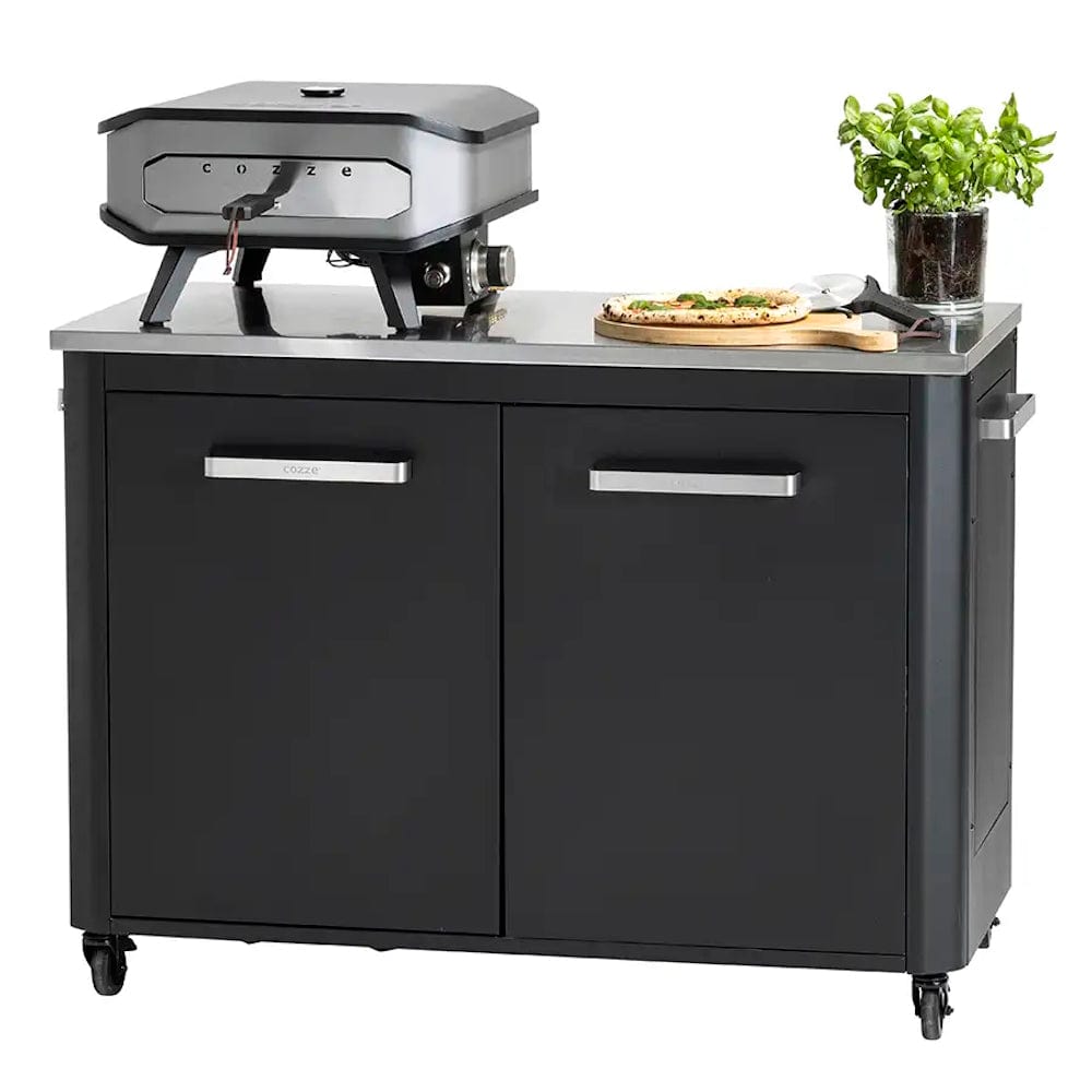 Cozze Outdoor Kitchen 2 Door Unit with grill, pizza, pizza cutter, cutting board and basil on it