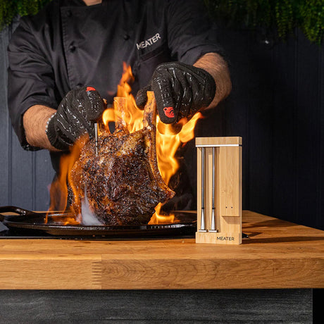 MEATER Pro Duo WiFi Thermometer man holding flaming steak