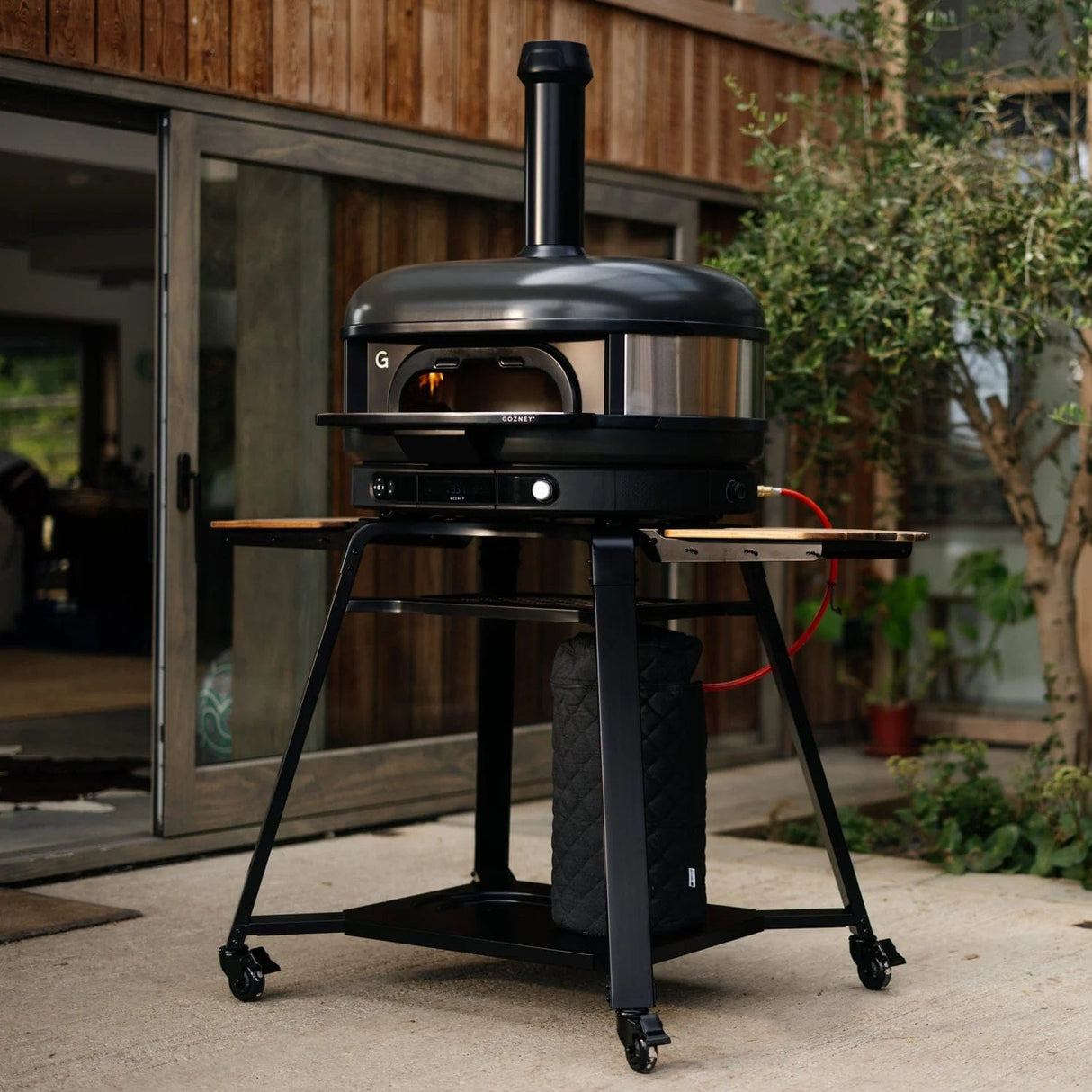 Dome XL Gen 2 Neapolitan Arch black oven in backyard