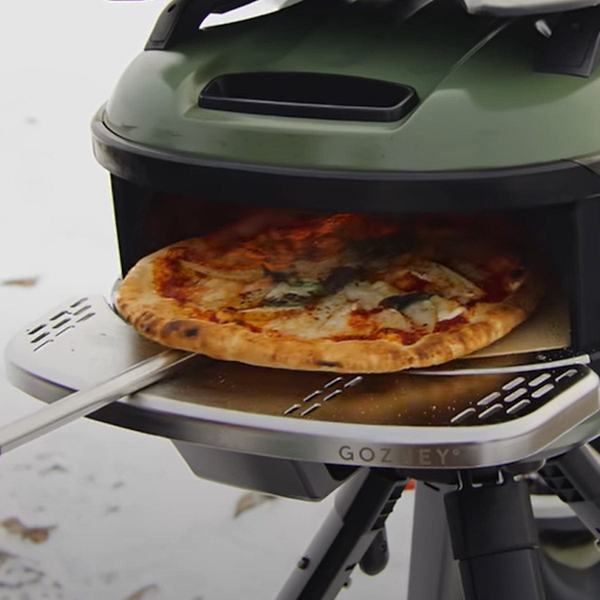 holding pizza on Tread Mantel