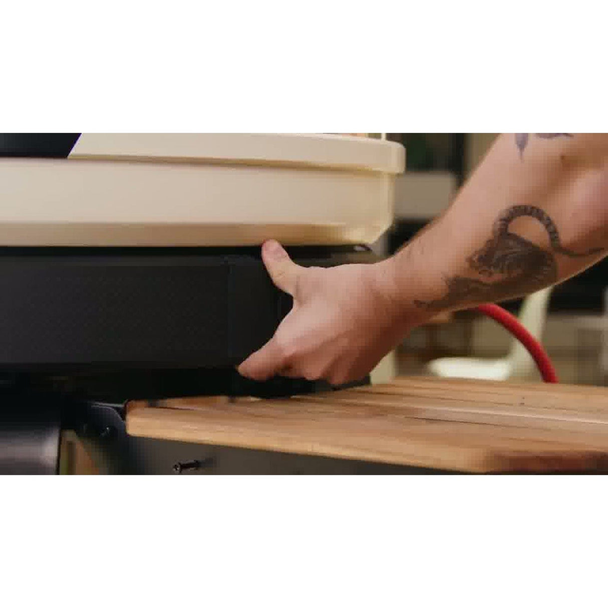 Wood-Fire Control Kit man inserting kit