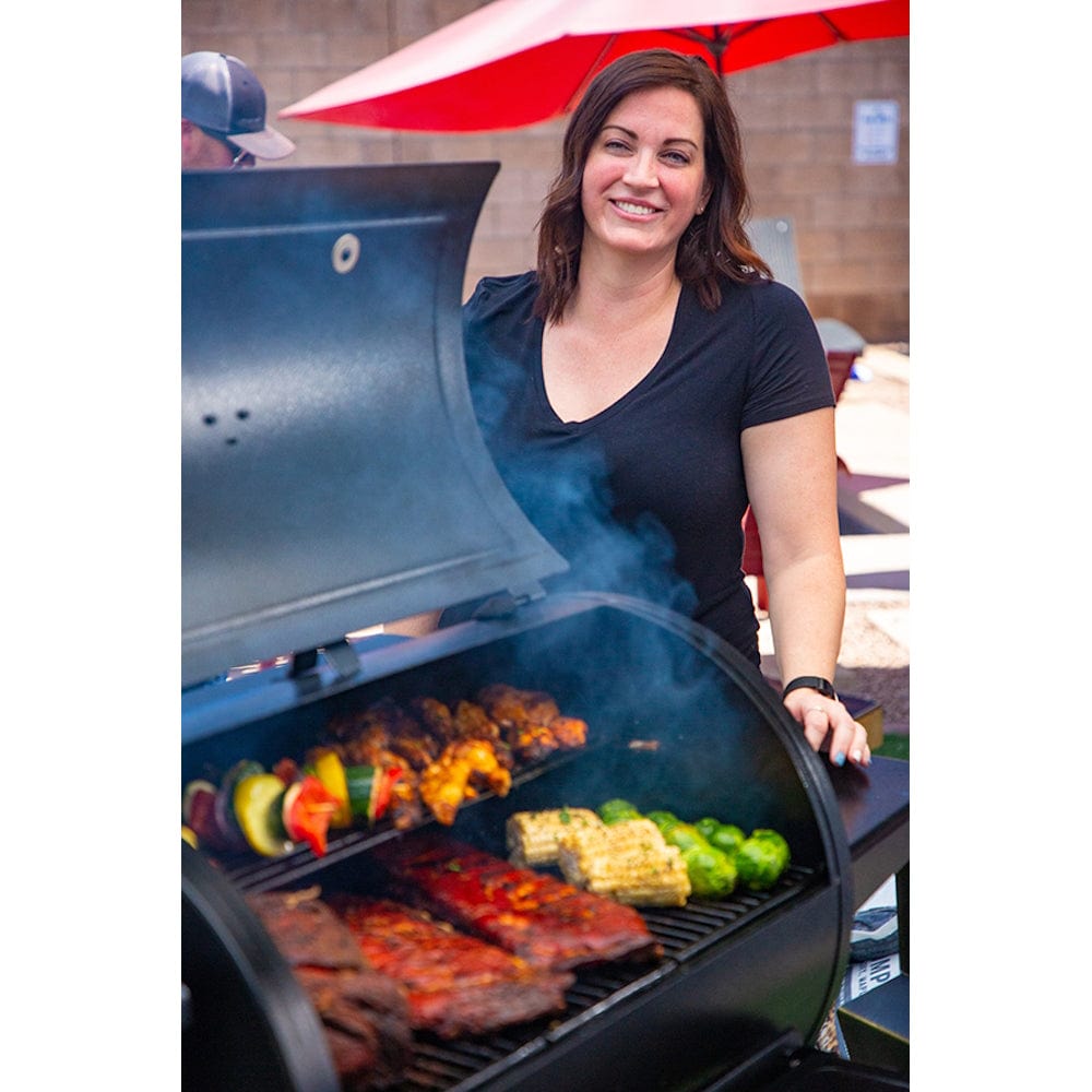 woman standing by Pit Boss 850G Navigator Series Grill