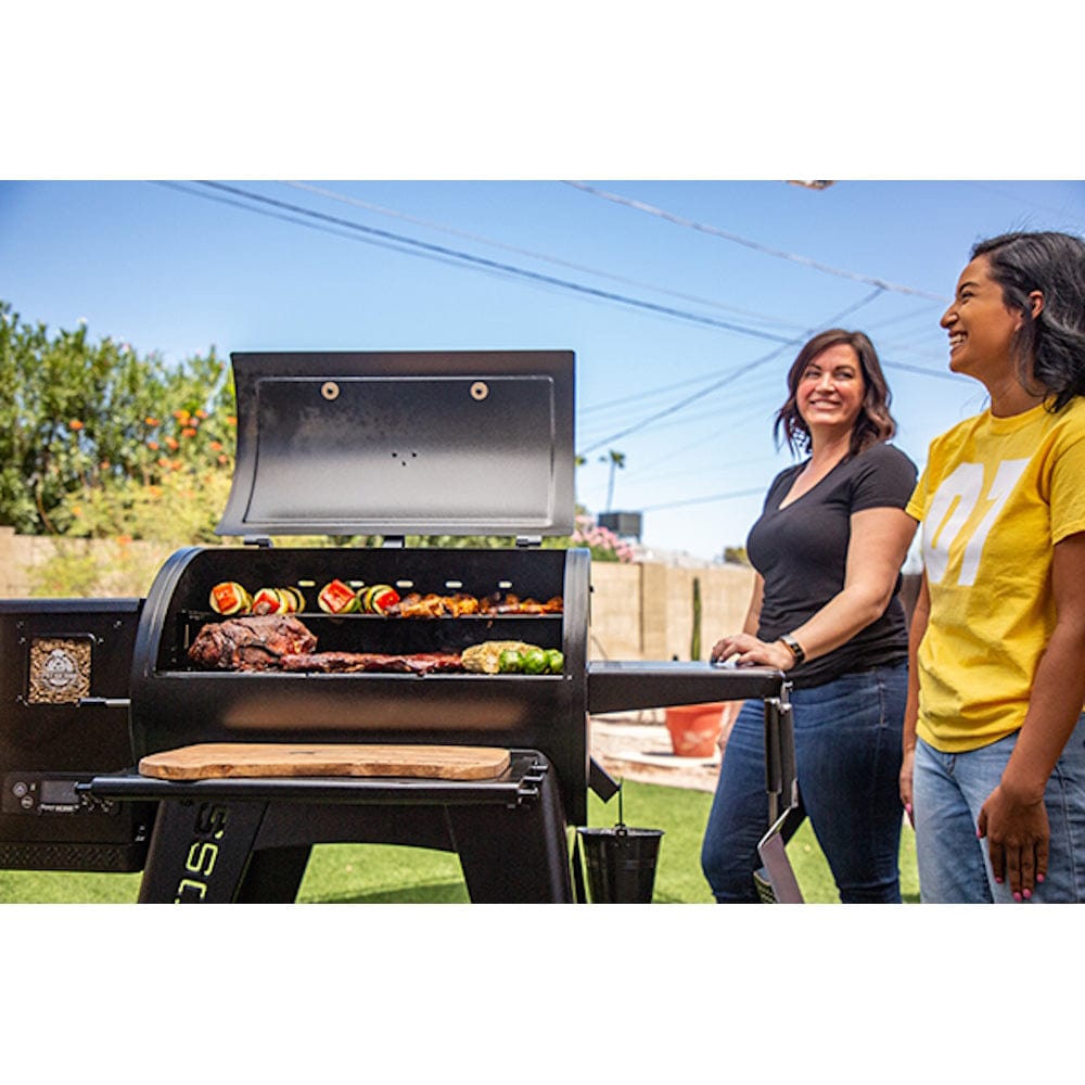women standing by Pit Boss 850G Navigator Series Grill