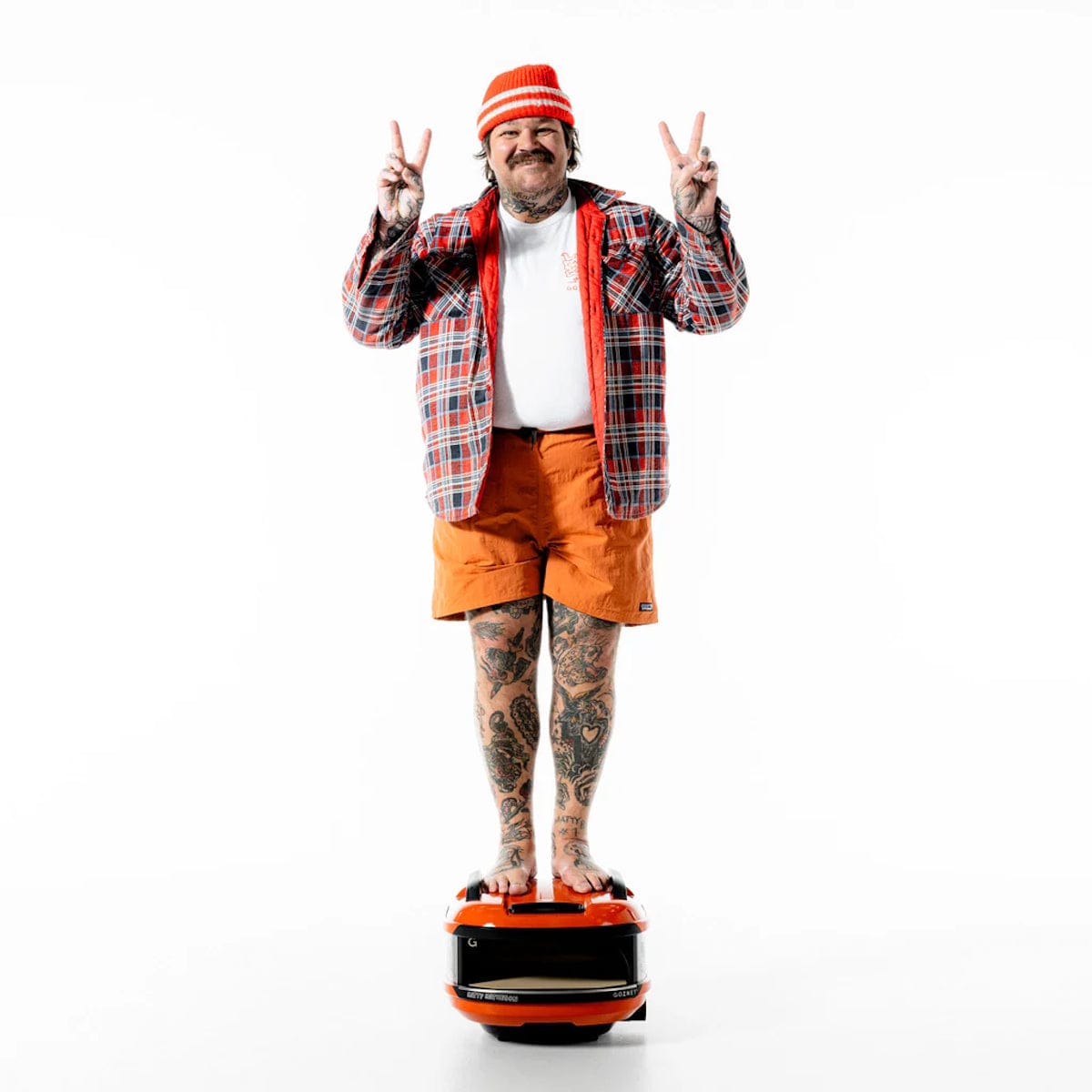 Gozney x Matty Matheson Portable Pizza Oven Matty standing on grill