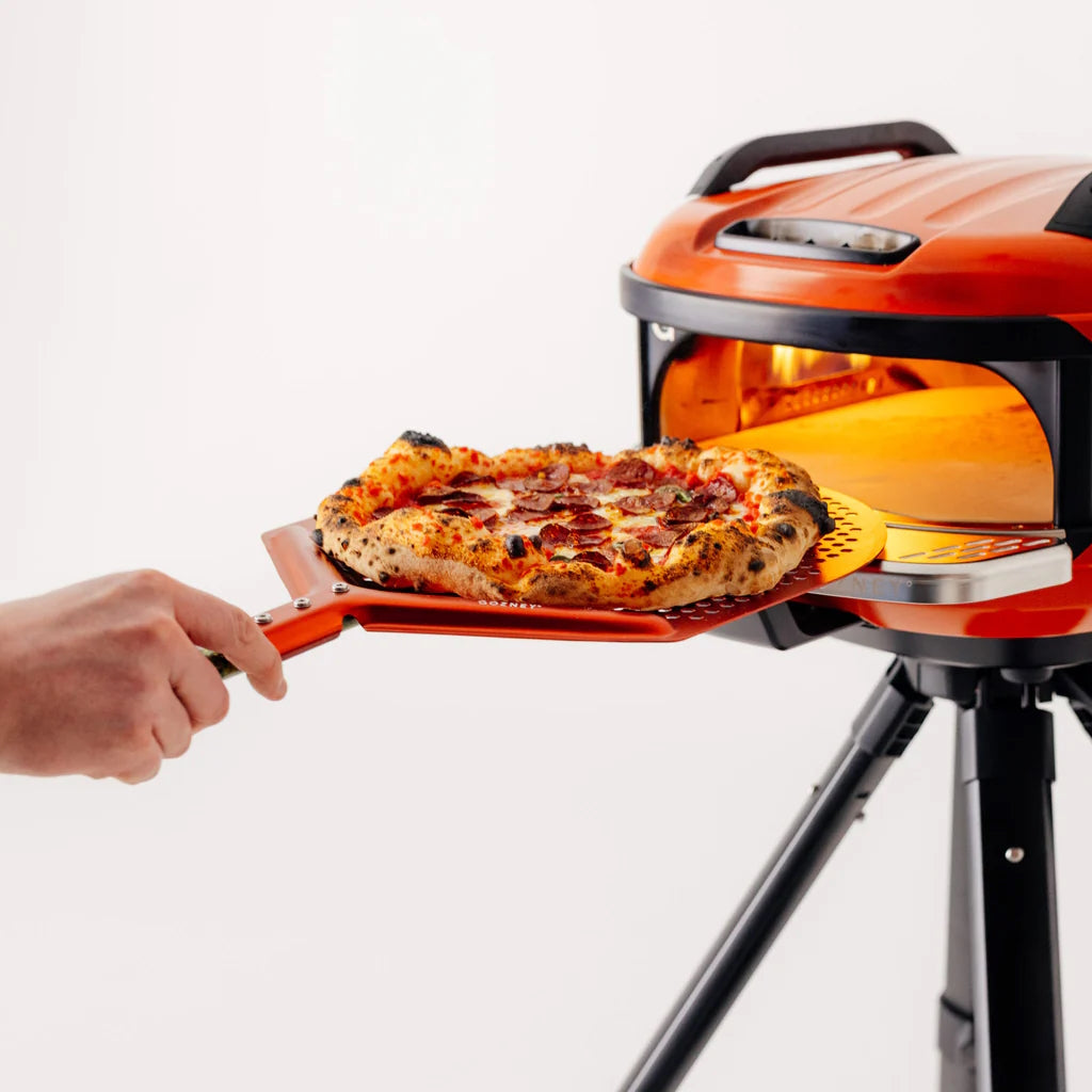 Gozney x Matty Matheson Venture Placement Peel pulling pizza out of the oven