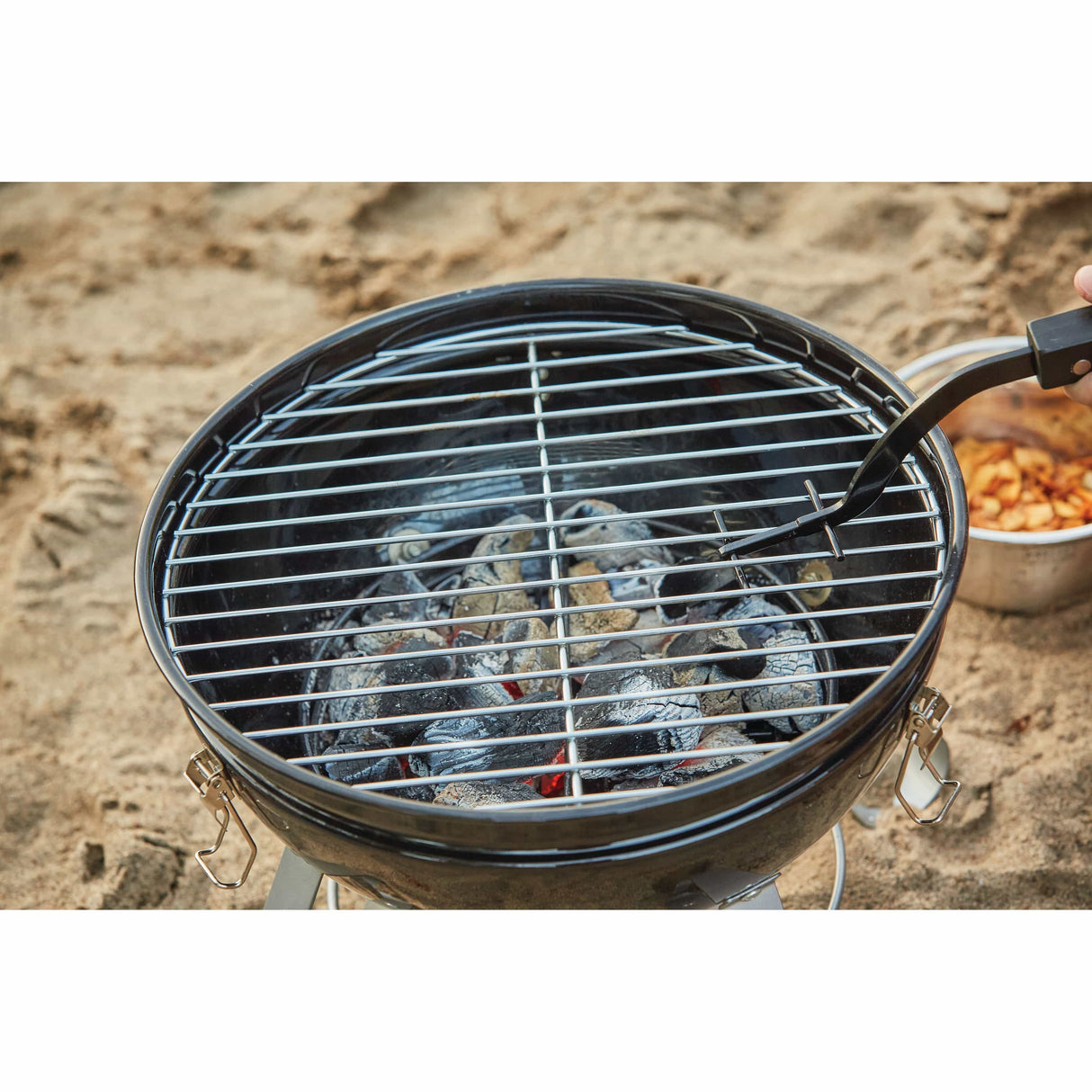 Grid Lifter with Hardwood Handle in use outdoors