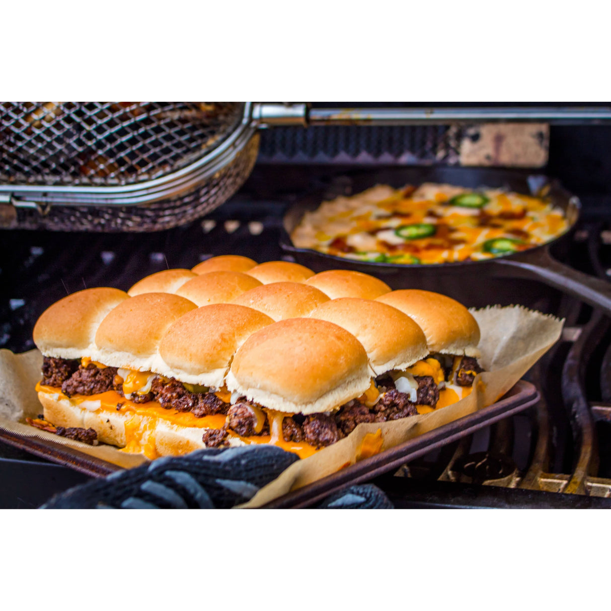 Napoleon Rotisserie Grill Basket man holding sliders