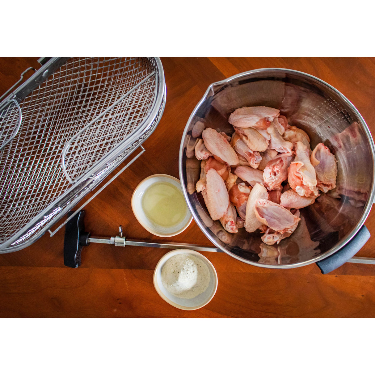 Napoleon Rotisserie Grill Basket preparing wings