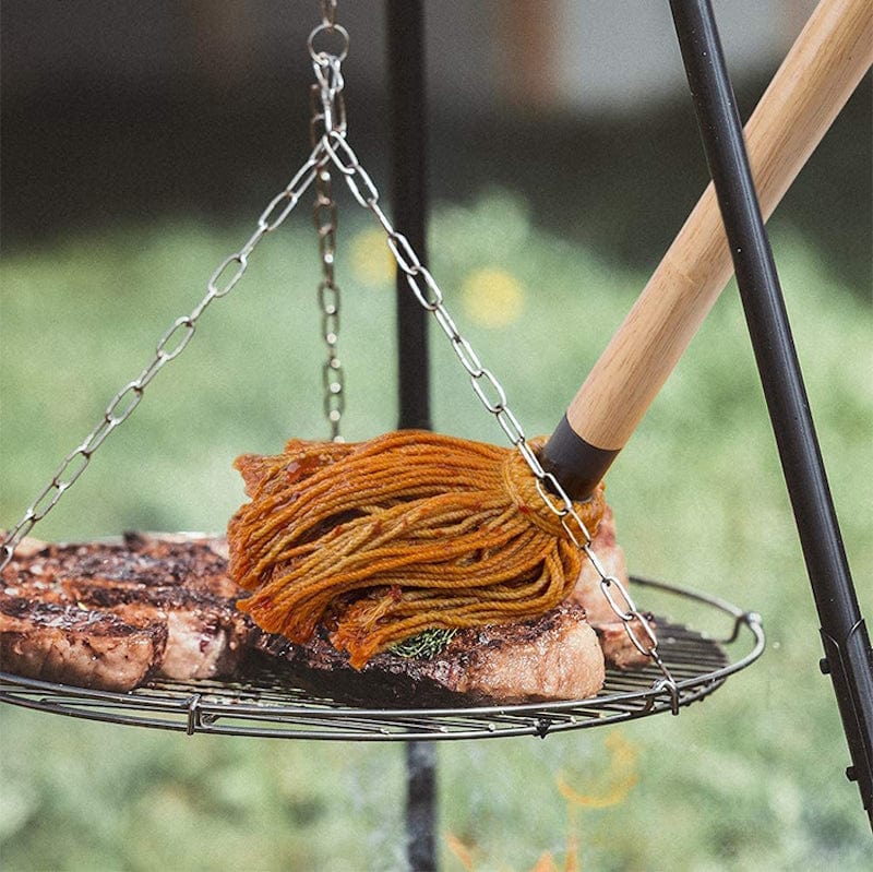 using Barbecue Basting Mop on a meat