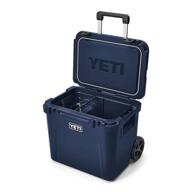 a Navy YETI Roadie - 60 Wheeled Cool Box shown with opened lid