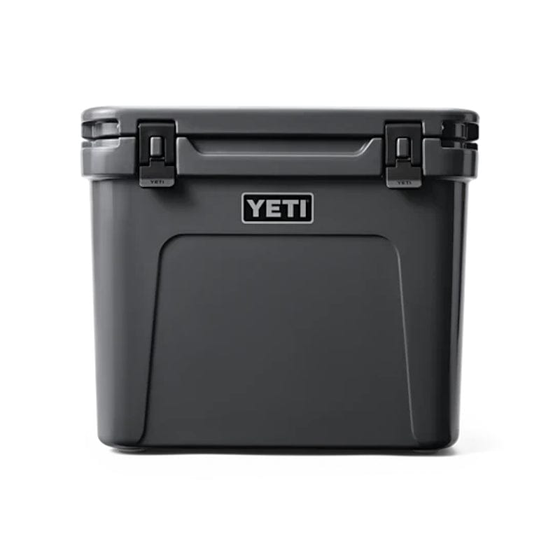 front side of a closed lid and retracted handle Charcoal YETI Roadie - 60 Wheeled Cool Box