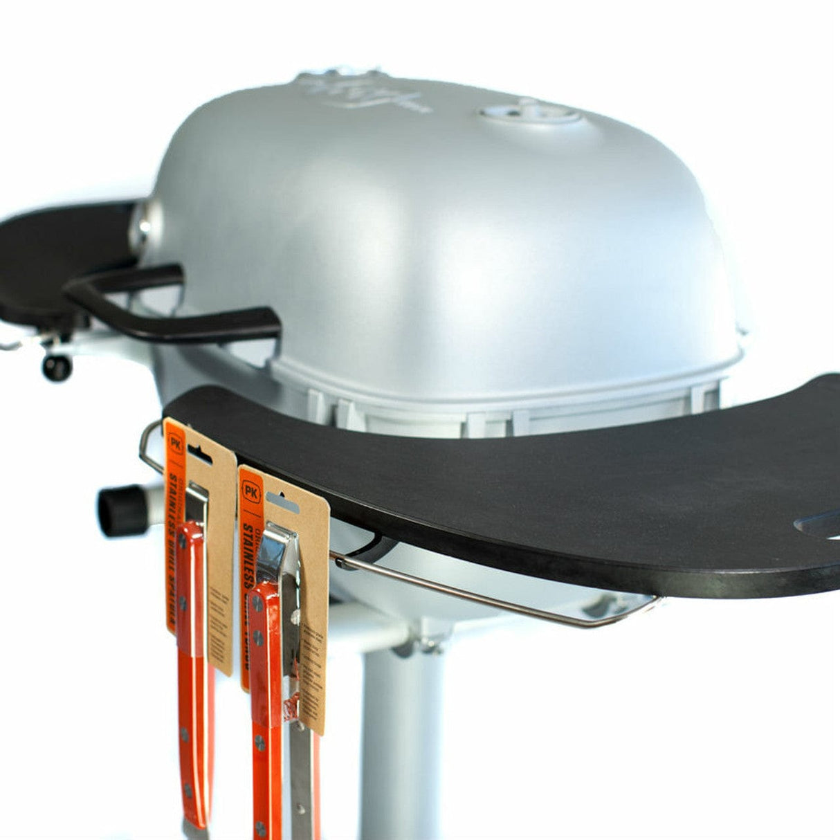 grilling tools hanging on shelves of PK360 Aluminium Charcoal Grill & Smoker