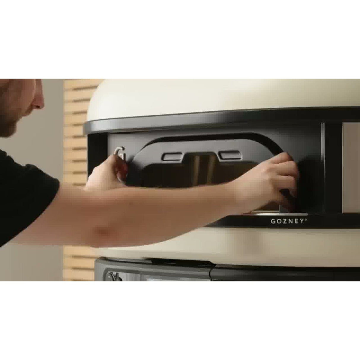 Dome XL Gen 2 Neapolitan Arch man mounting arch on oven