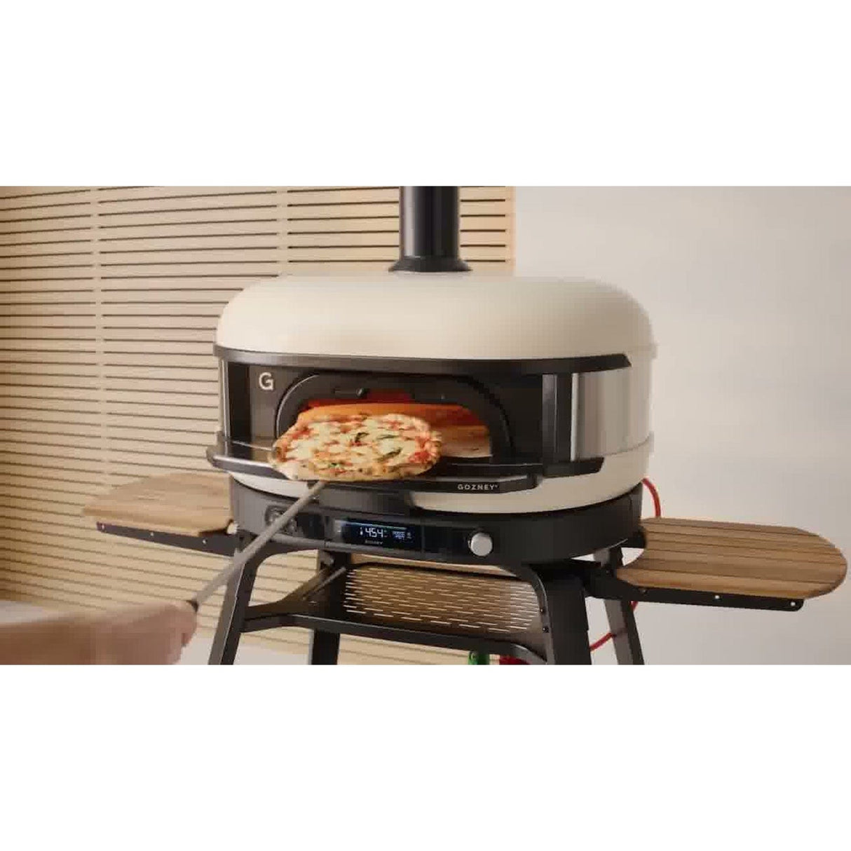 Dome XL Gen 2 Neapolitan Arch man pulling out pizza