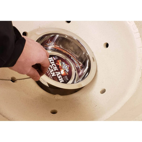 Large Kick Ash Can man placing can in grill