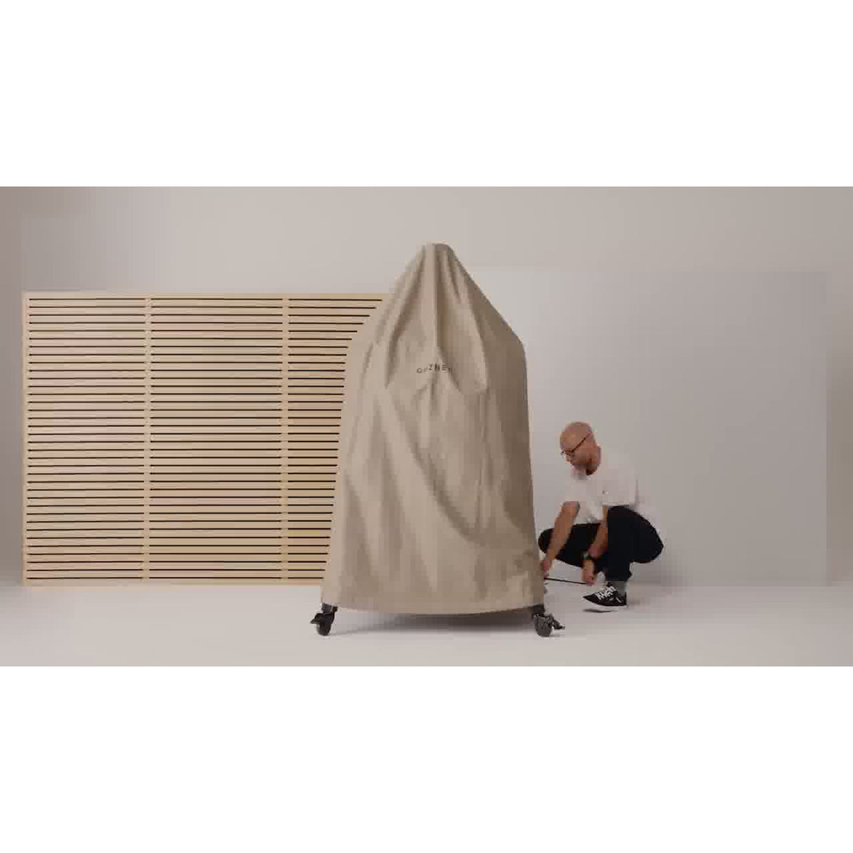 Dome Gen 2 Outdoor Stand Cover man finishing the covering process