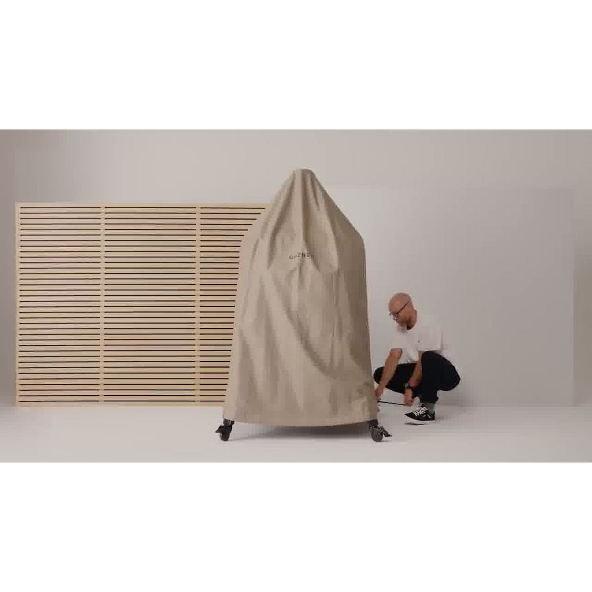 Dome Gen 2 Outdoor Stand Cover man finishing the covering process