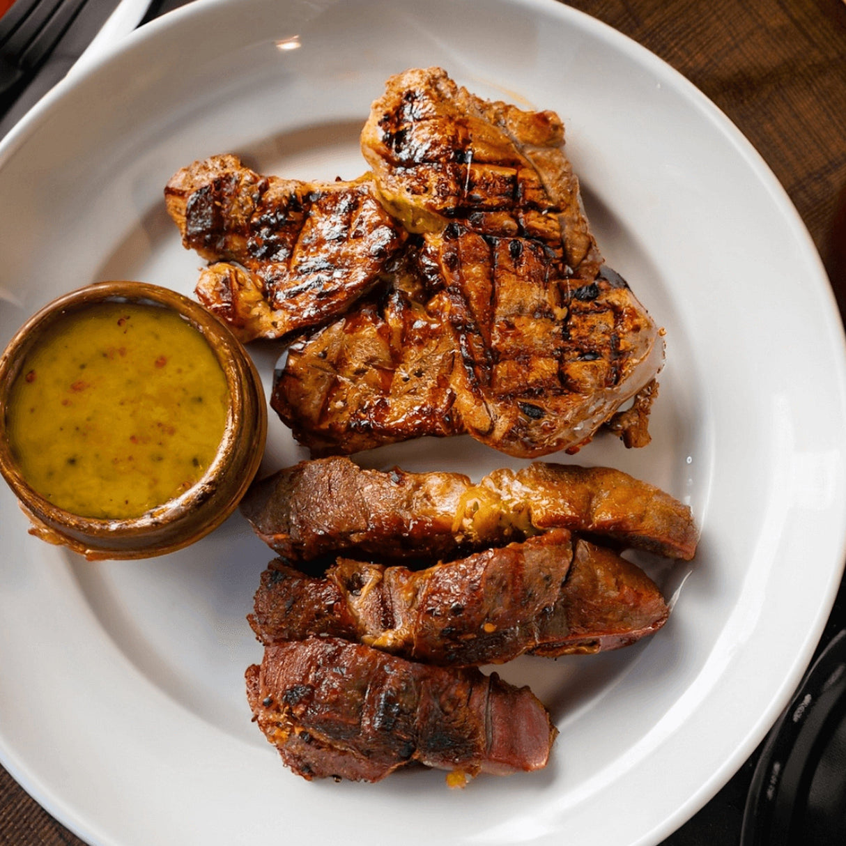 LeRoy & Lewis Mustard BBQ Sauce sauce next to meat on plate