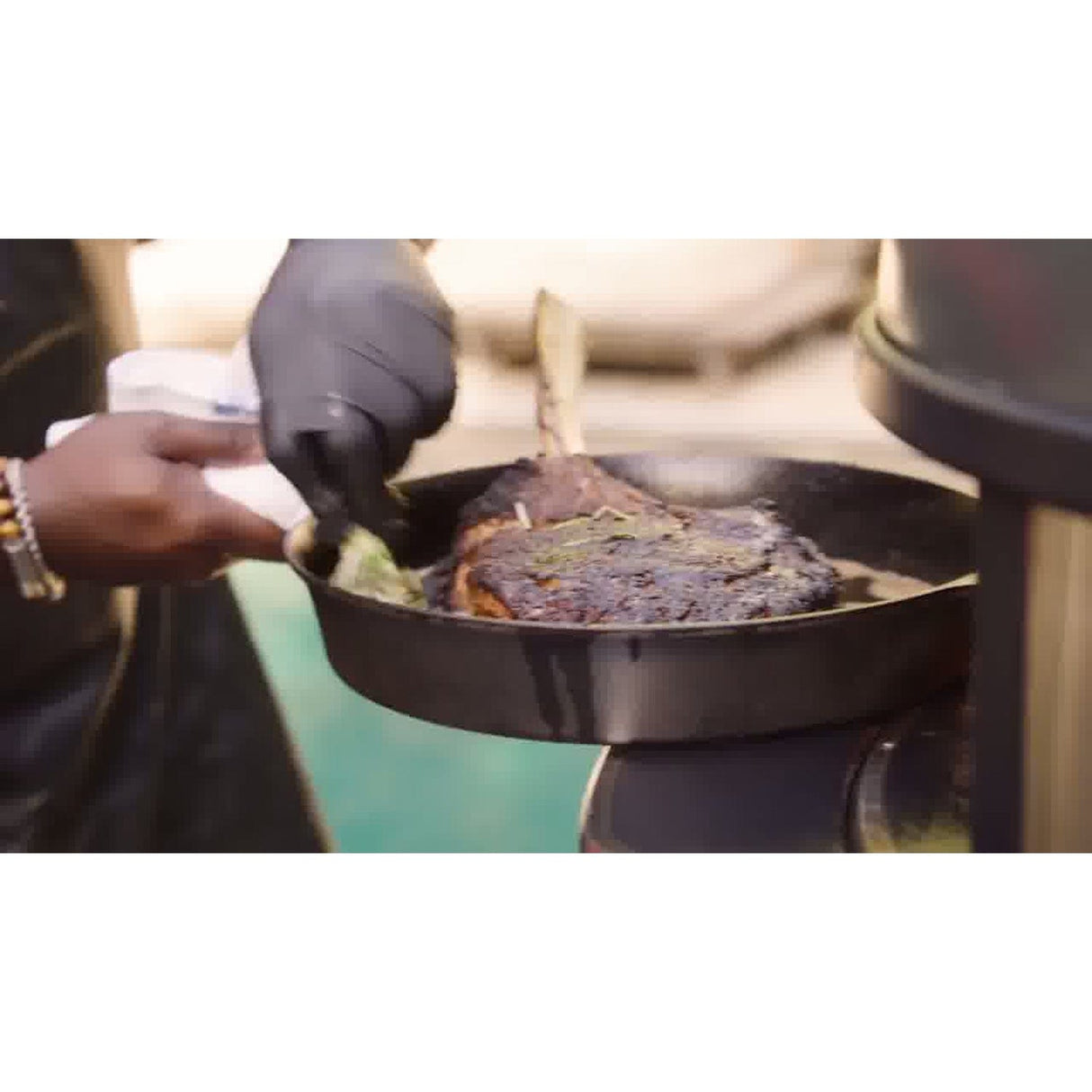 Dome Gen 2 Mantel man cooking steak in iron pan