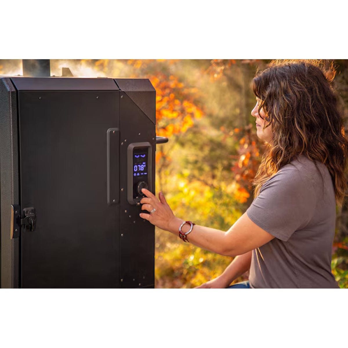 4-Series Vertical Wood Pellet Smoker woman setting temperature