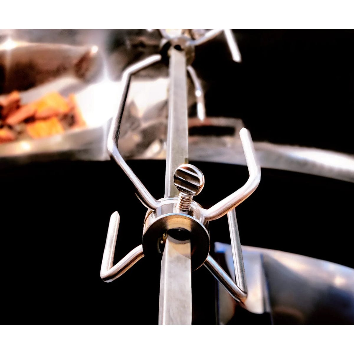 Slow N Sear Kettle Ring Rotisserie close up meat forks attached to skewer