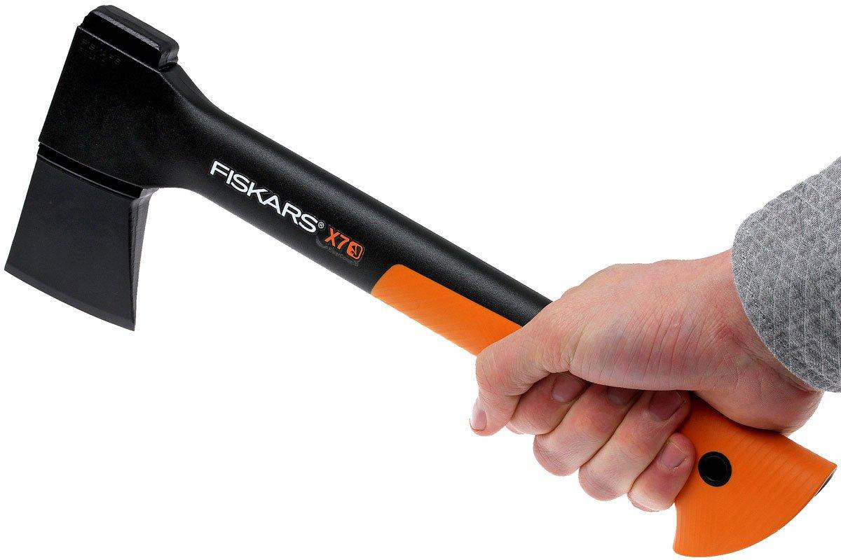 hand holding Fiskars x7 Premium Axe