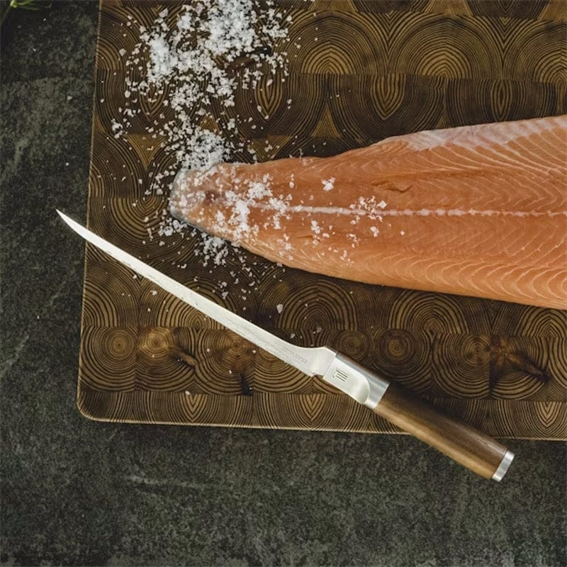 Fiskars Norden Filleting Knife next to fillet