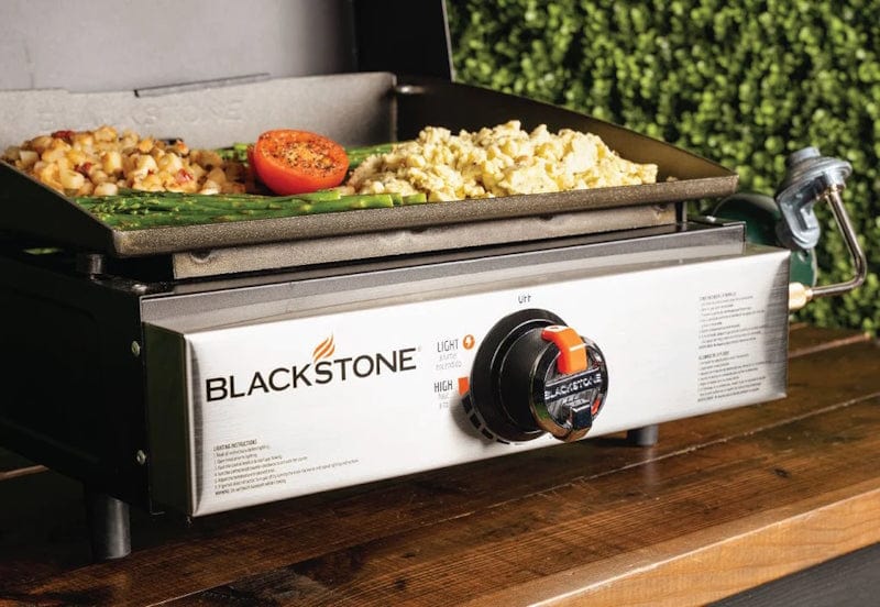 close up image of a Blackstone 17" Griddle with Hood while cooking veggies