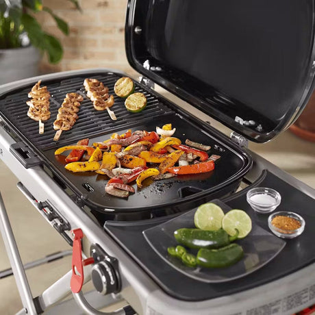 grilling food on Griddle for Weber Traveler Gas Barbecue