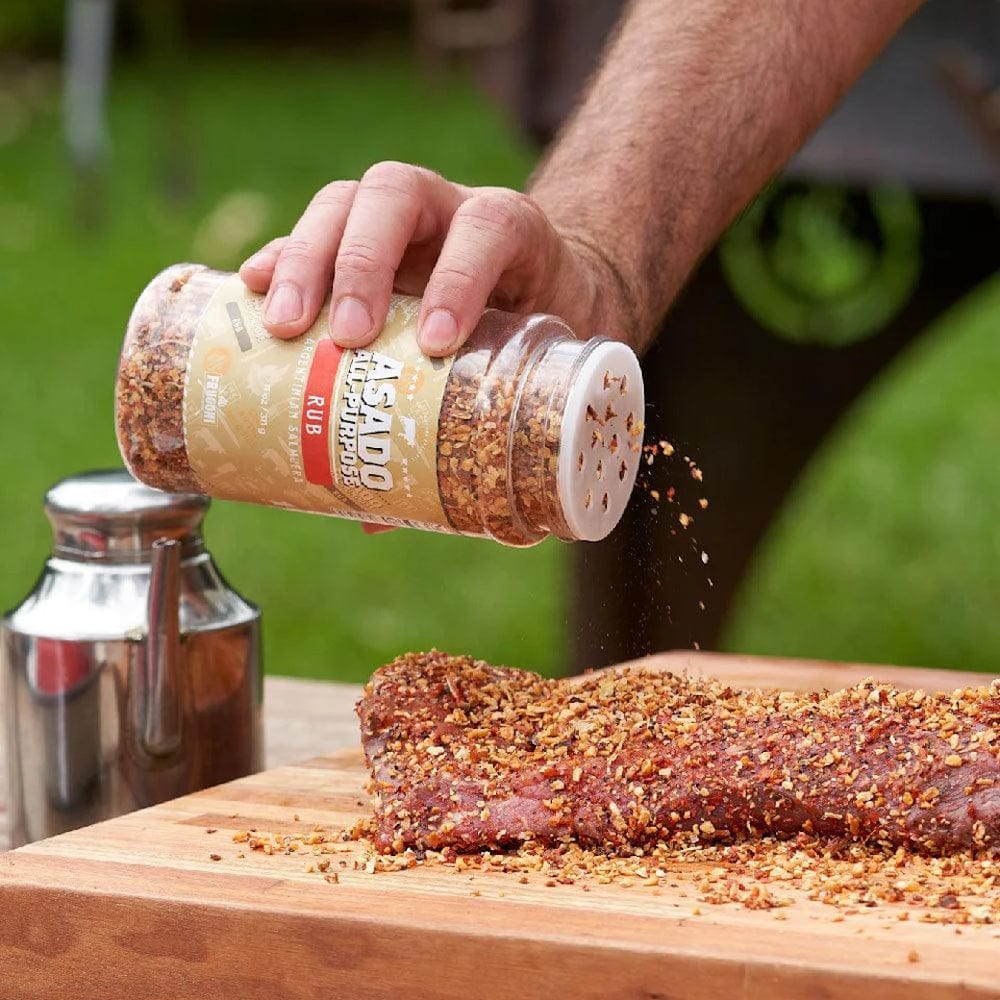 seasoning meat with Al Frugoni Asado All Purpose Rub