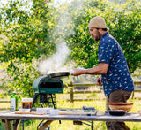 man grilling food with Gozney Roccbox Brad Leone Limited Edition