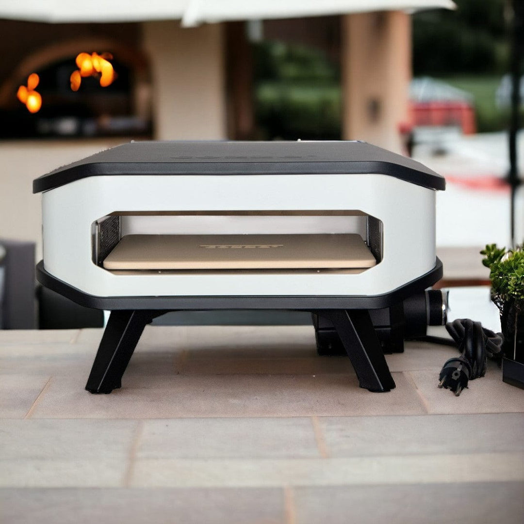 Cozze Electric Pizza Oven outdoors with pizza stone inside