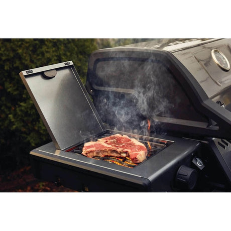 grilling steak on Napoleon Freestyle 425 SIB with lid open 