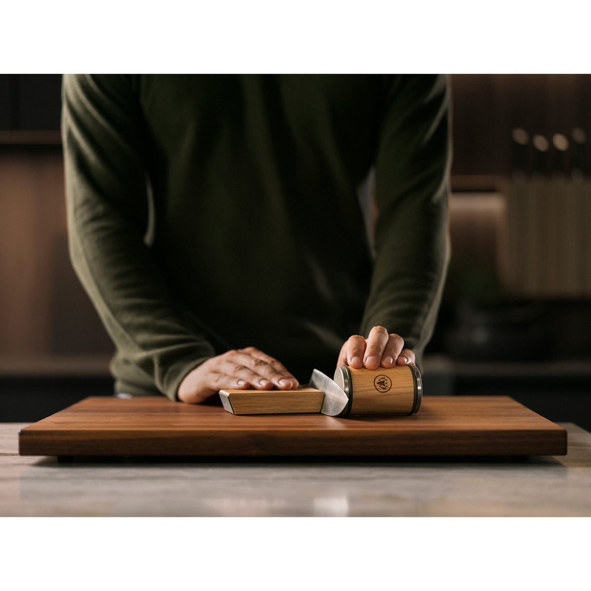 a man sharpening a knife with HORL 3 Oak