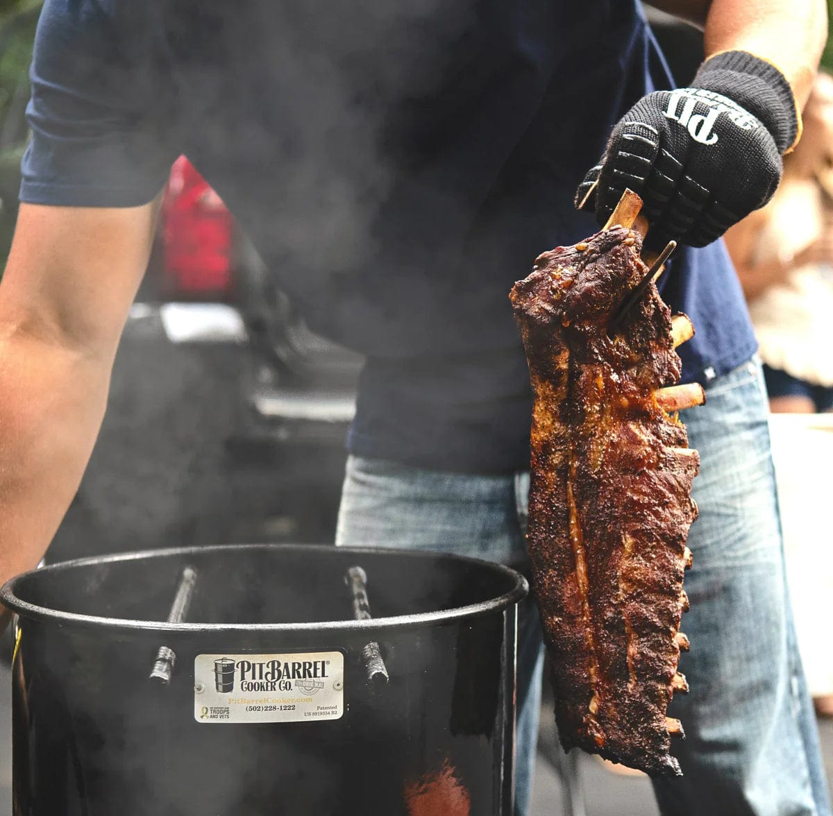 preparing ribs with Pit Barrel Cooker Junior Package