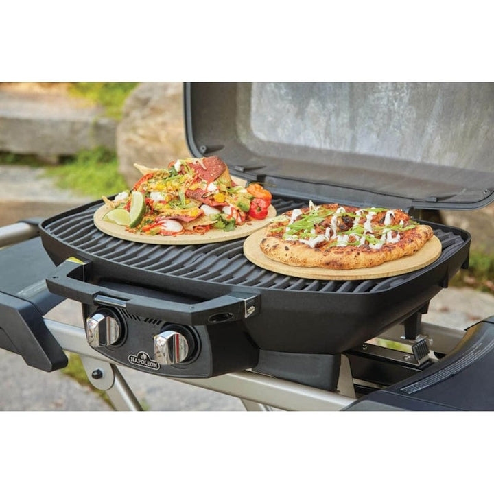grilling food on Napoleon Portable Gas Grill with Scissor Cart