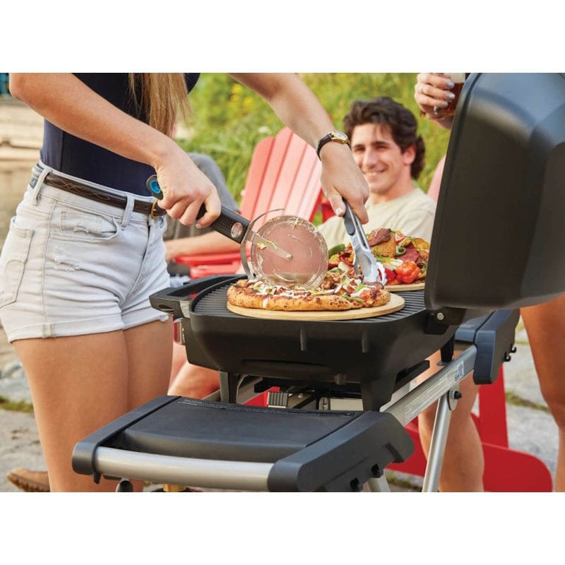 grilling on Napoleon Portable Gas Grill with Scissor Cart