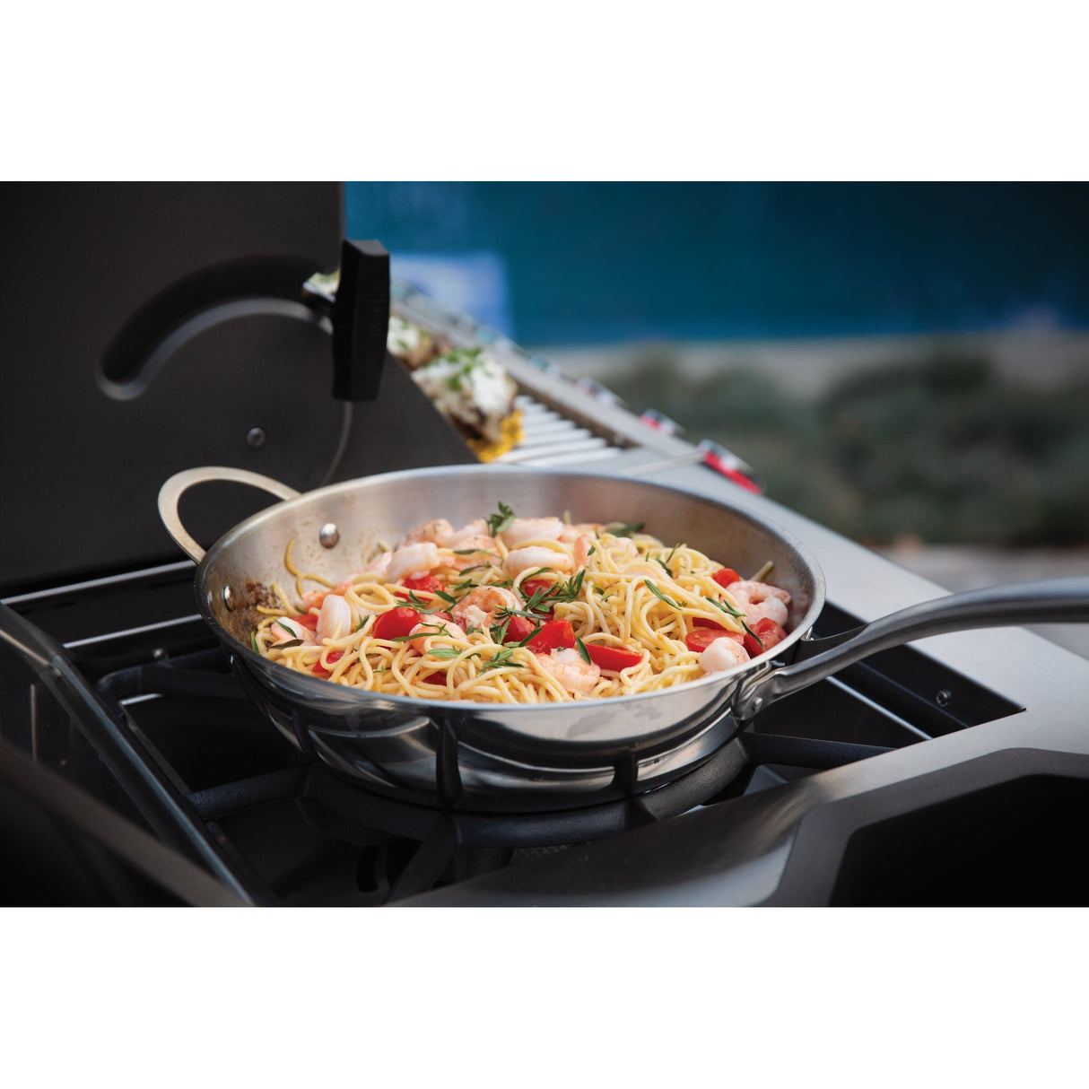 Napoleon Prestige PRO 825 RSBI with shrimp and pasta on side burner