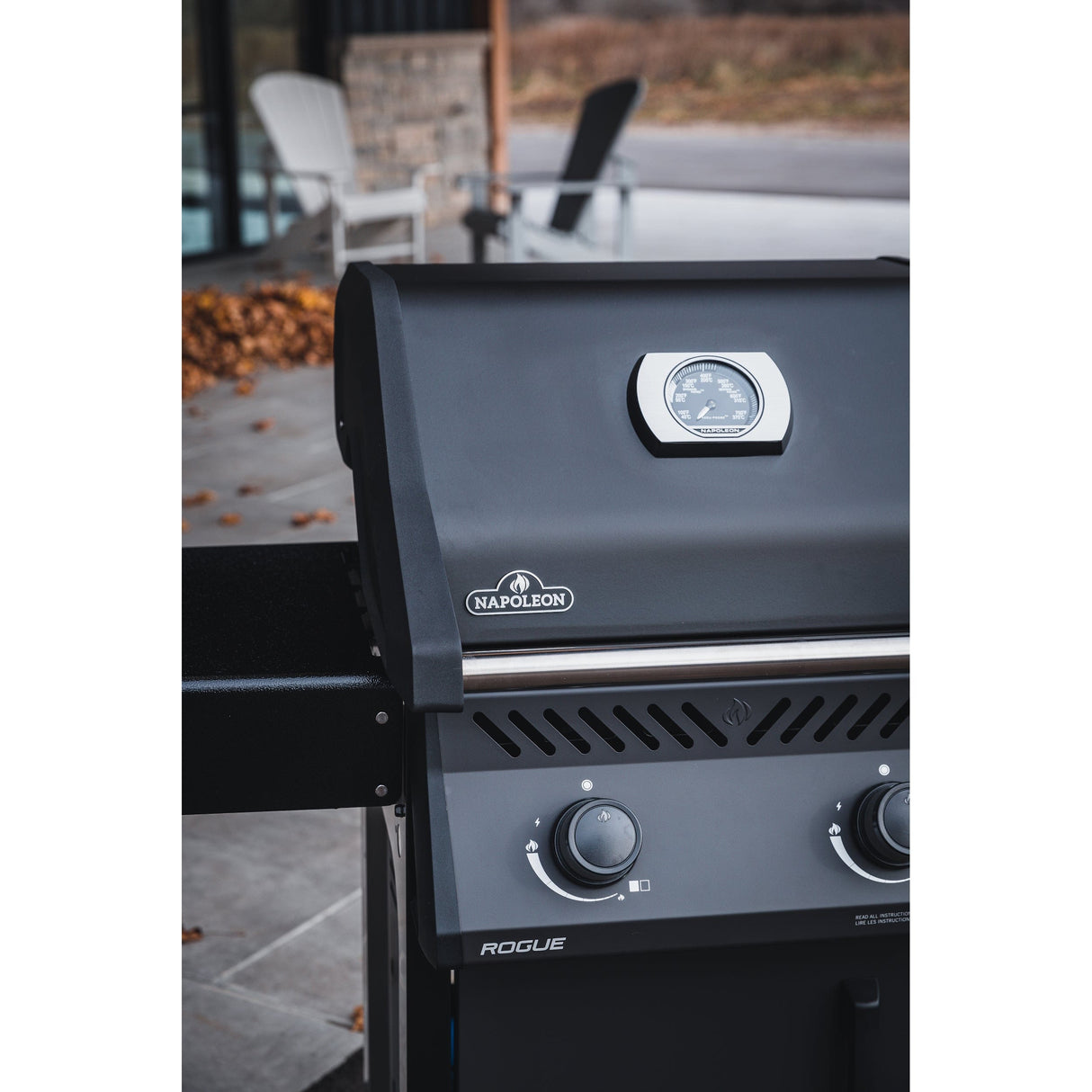 Napoleon Rogue 365 2-Burner Gas Grill knobs, lid with thermostat and napoleon logo outdoors