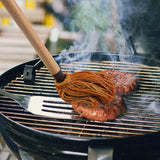 Barbecue Basting Mop on a grill