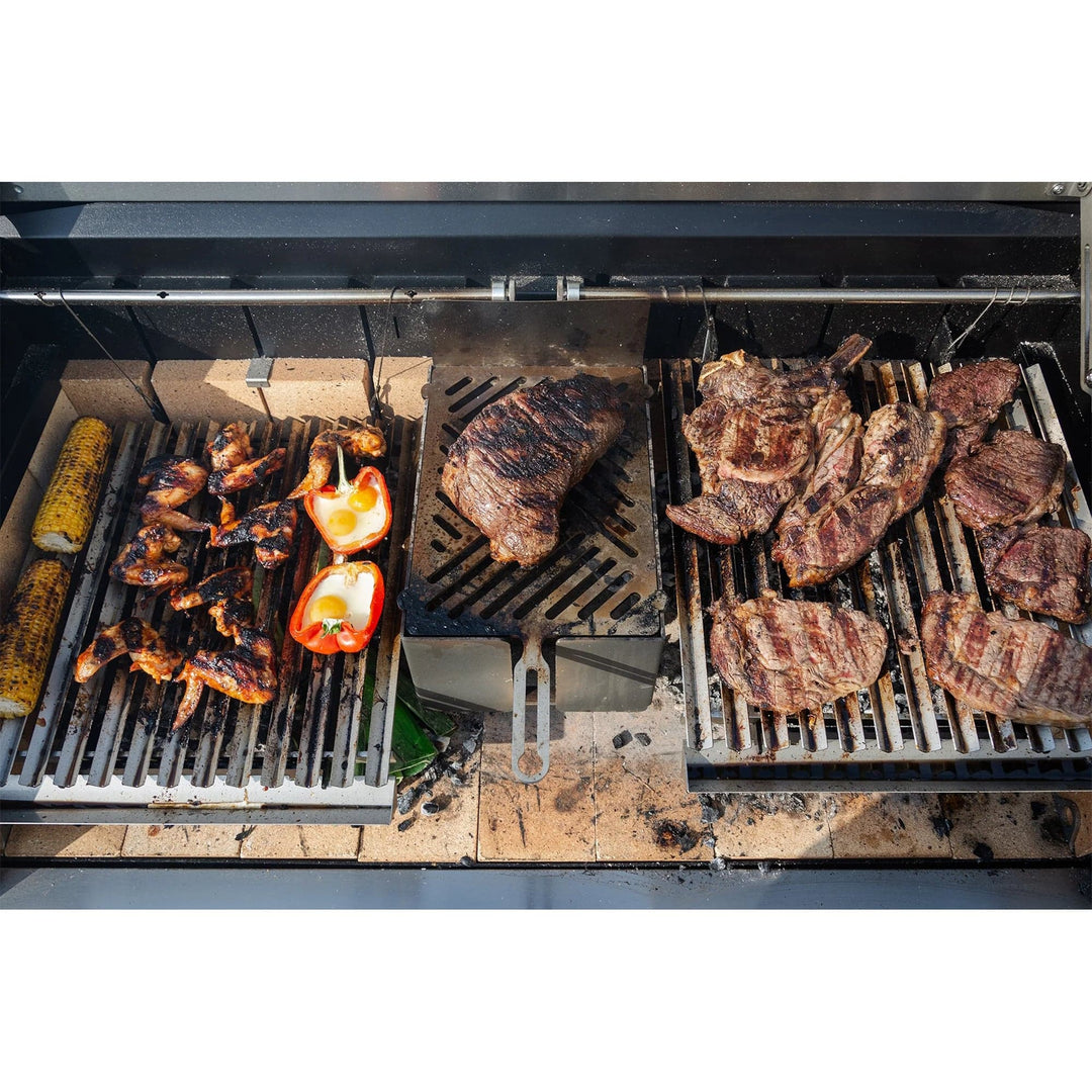 grilling steak and vegetables on a Large Asado Grill on Trolley