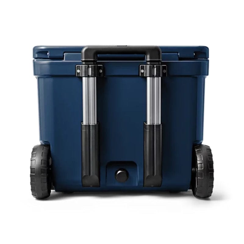 back part of a closed Navy YETI Roadie - 60 Wheeled Cool Box shown with retracted handle