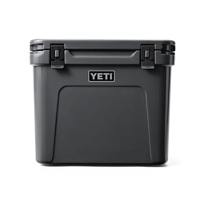 front side of a closed lid and retracted handle Charcoal  YETI Roadie - 60 Wheeled Cool Box 