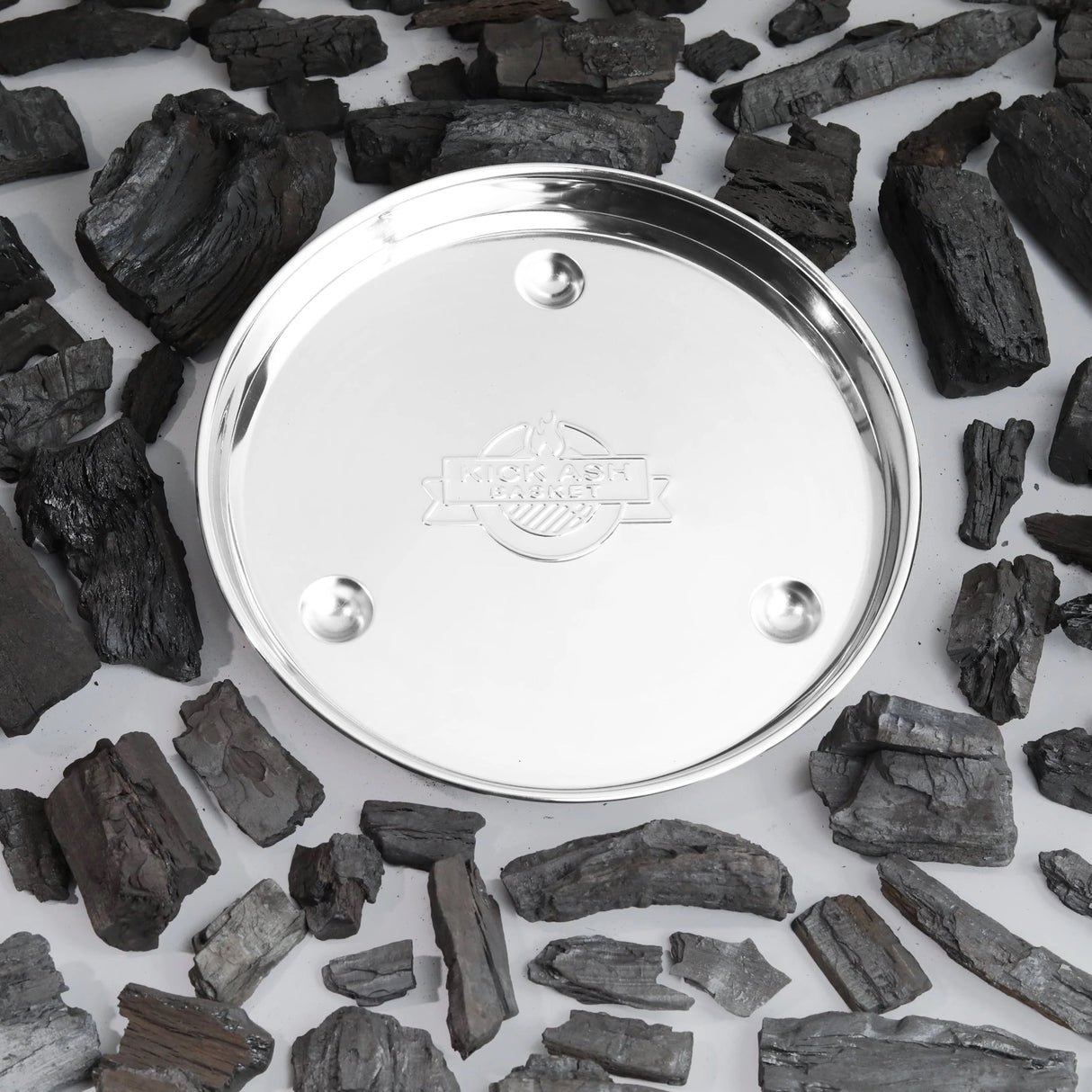18 Inch BBQ Drip Tray on white surrounded by coals